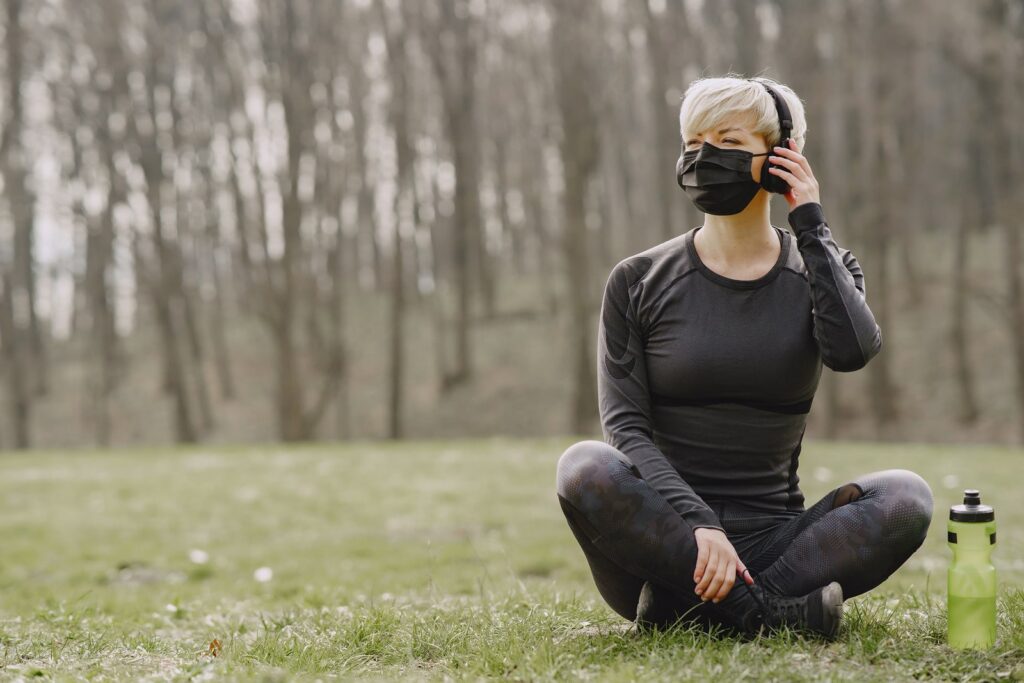 Girl with mask listening to music